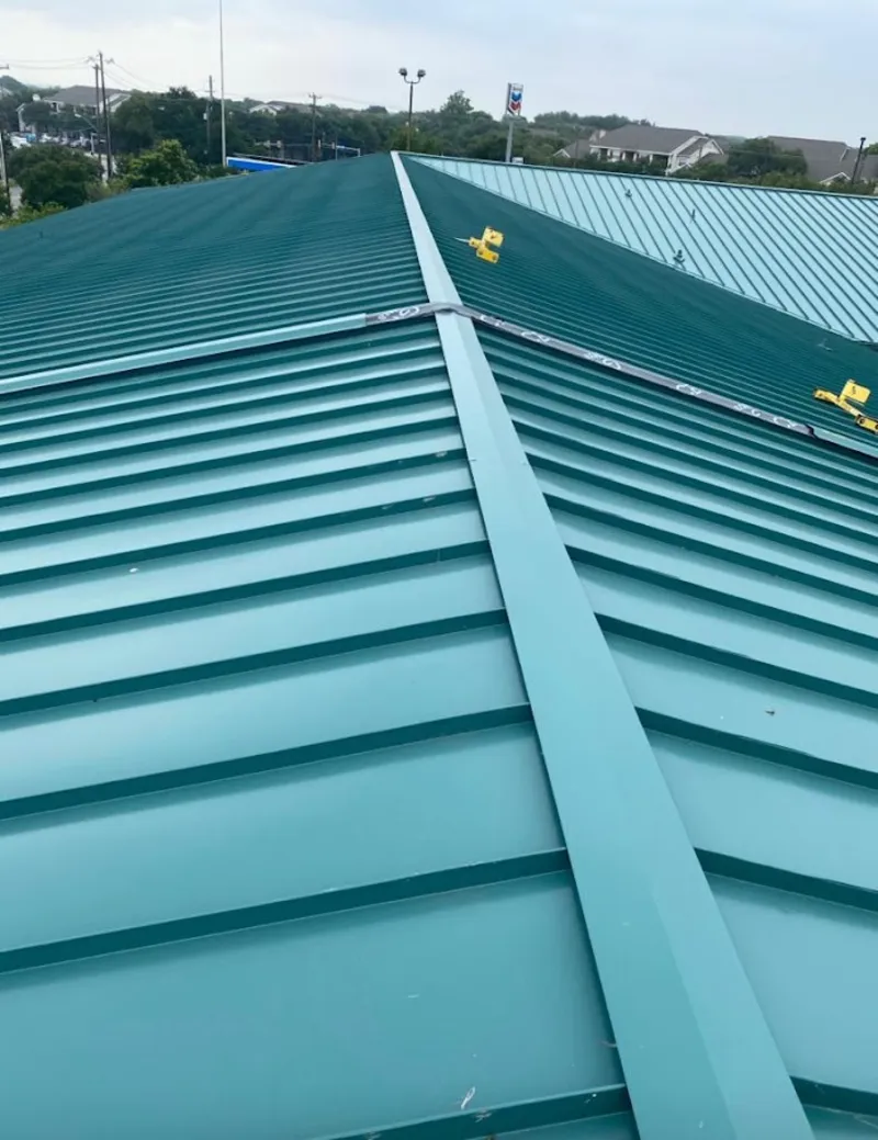 Green commercial metal roof ridge and valley for Metal Roof Repair in Winston