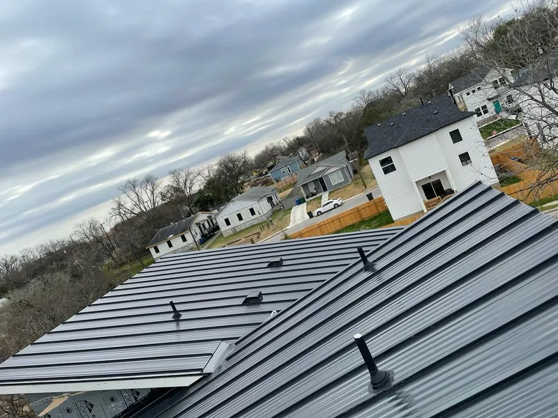 Standing seam metal roof panels with vents for Skylight Repair in Winston